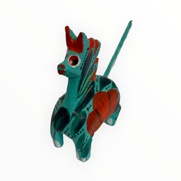 Capture the essence of Mexican artistry with our handcrafted turquoise alebrije pony sculpture. Intricately carved and adorned with vibrant turquoise hues, this unique piece embodies the beauty and tradition of Oaxacan craftsmanship.