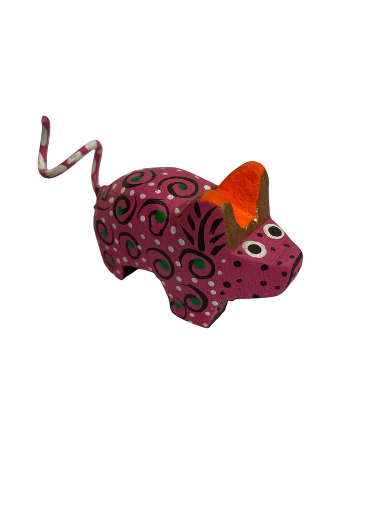 Charming Mini Alebrije Pig, handcrafted to reflect the vibrant colors and intricate details of Mexican folk art. This joyful figurine symbolizes abundance and positive energy, making it a unique addition to your space.