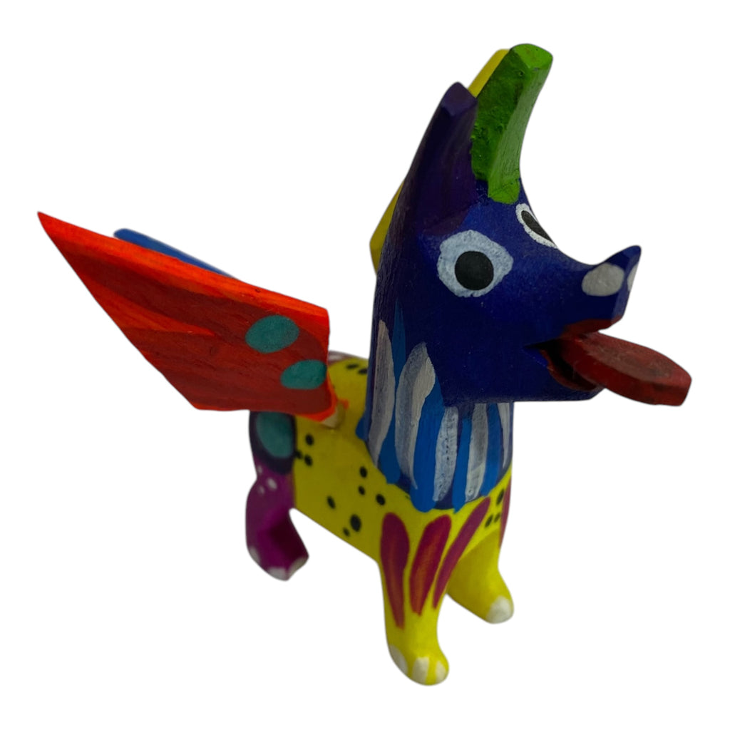 Mini Coco Alebrije Dog sculpture featuring bright colors and detailed carvings, showcasing the exceptional craftsmanship of indigenous artisans. A perfect tribute to 'Coco' and alebrije tradition.