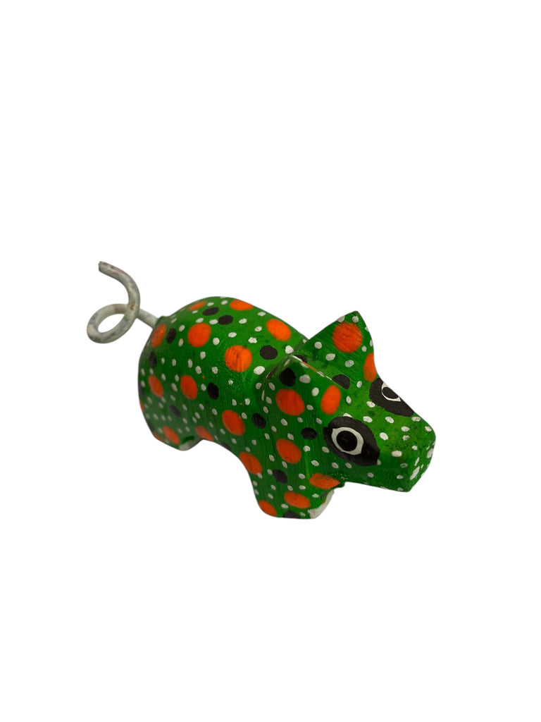 Delightful handcrafted Mini Alebrije Pig, embodying playfulness and prosperity. This colorful figurine brings traditional Mexican craftsmanship and a spirit of abundance into your home or collection