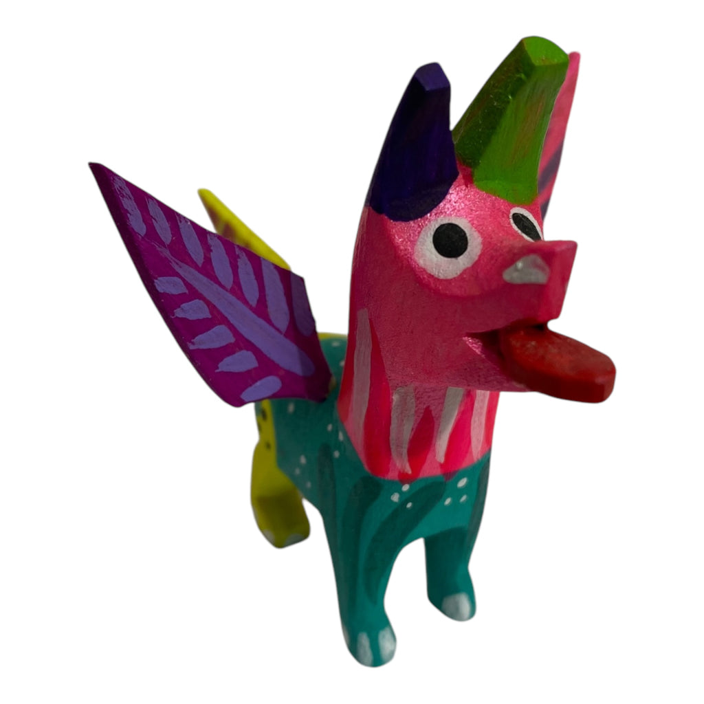 Handcrafted Mini Coco Alebrije Dog, bringing the magic of Disney’s 'Coco' into your home. A unique gift that supports the preservation of traditional Mexican craftsmanship.