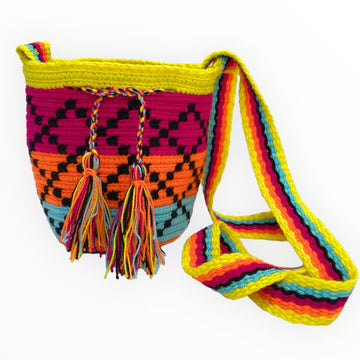 Vibrant neon-colored handmade crochet mini bag with intricate boho tribal design, made by indigenous Wayuu artisans using fair trade practices and sustainable, natural resources.