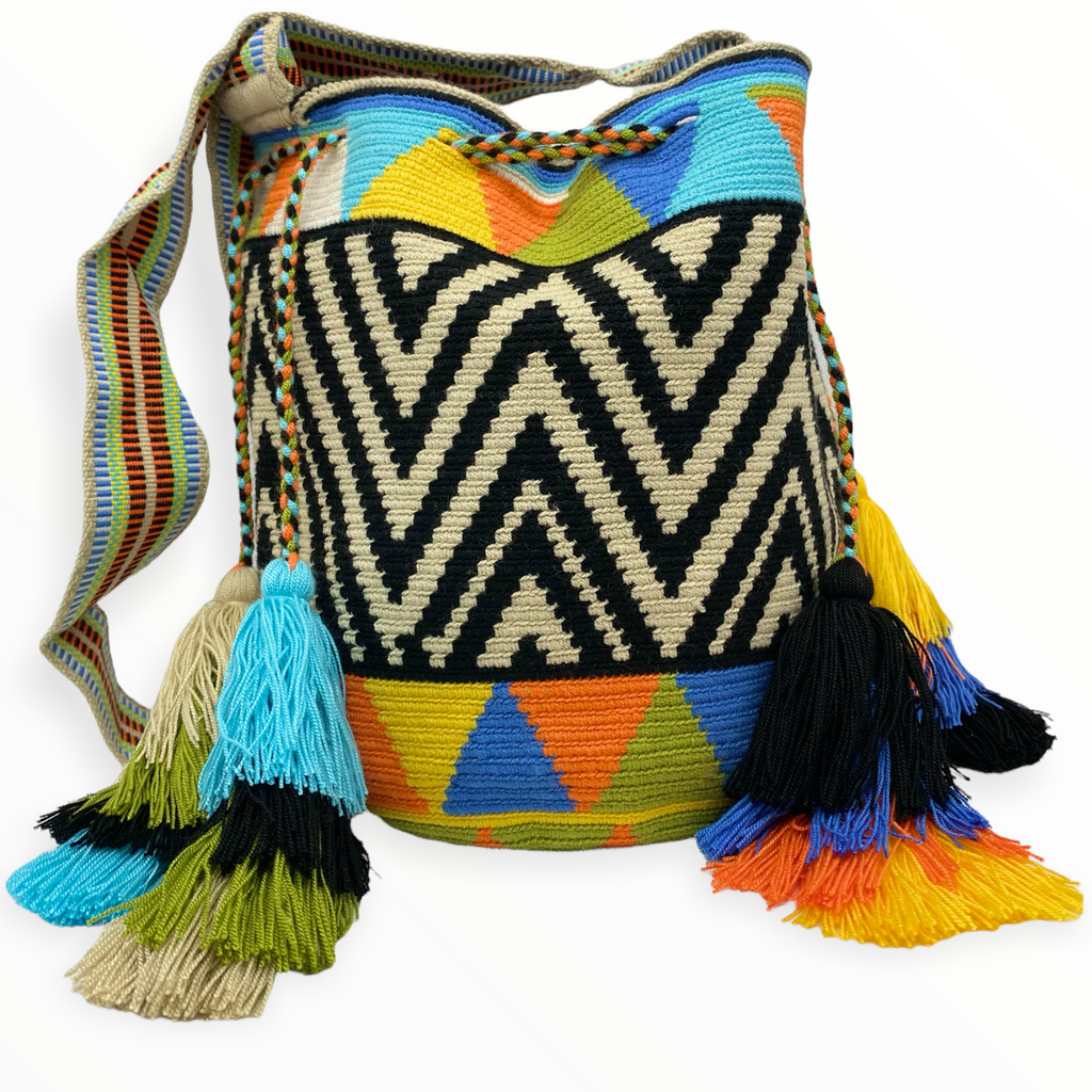 Beautiful bag for a chill day! This beautiful crossbody bag is perfect for any outfit.  Its vibrant colors and precious patterns will connect you to the roots of the Wayuu indigenous people.
