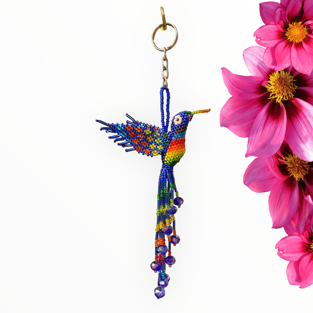 Elegant navy blue hummingbird keychain with Vibrant multicolor rainbow touch. Handcrafted with  intricate beadwork, a burst of joy in every shade